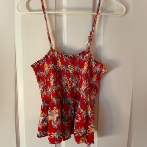 Hawaiian print flowy crop top with adjustable straps!
